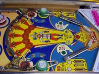 Image # 30300: Dodge City Lower Playfield 
(The posts below the round green bumpers have been moved from their original positions. The kick-out holes have been repainted in black.)