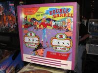 Image # 83596: Double Barrel Backglass 
(The backbox has been repainted. Photographed at the 2013 Pinball Expo in Chicago.)