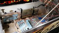 Image # 67926: Dyn O' Mite Inside Cabinet - Left Side 
(A free-play switch has been added to the credit button after the game left the factory.)