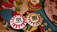 Image # 68578: Dyn O' Mite Pop Bumper Cap Comparison 
(A reproduction pop bumper cap on the left is presented here to illustrate its difference from the manufacturer's original cap on the right.)