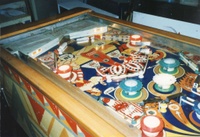 Image # 6541: Falstaff Playfield,Showing Cardholder Lamps 
(Illuminated lamps under the cardholder shine onto the playfield as an earned feature. Serial number D65761F.)