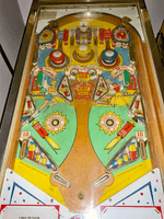 Image # 80267: Fire Cracker Playfield 
(The post between the flippers was added after-factory.)