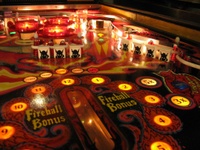 Image # 40268: Fireball II Illuminated Upper Right Playfield 
(The factory mylar has been removed from this playfield. The drop targets and bumper caps are after-factory manufacture using Bally's original dies.)
