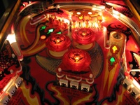 Image # 40269: Fireball II Illuminated Upper Playfield 
(The factory mylar has been removed from this playfield. The drop targets and bumper caps are after-factory manufacture using Bally's original dies.)