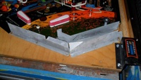 Image # 49151: Flight 2000 Ball Serve Solenoid Below Playfield 
(Serial number 6324. Playfield edge has no date.)