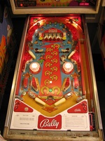 Image # 45689: Flip Flop Prototype Game - Illuminated Playfield 
(The mushroom bumpers were originally white but were replaced with yellow ones by a collector.)