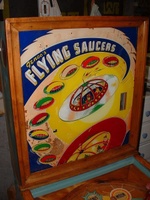 Image # 58732: Flying Saucers Backglass 
(The rectangular window on the right side of the backglass allows the player to view a pendulum tilt.)