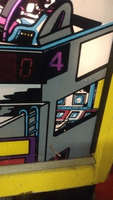 Image # 74359: Gamatron Backglass - Artist Signature 
(Artist Seamus McLaughlin signed with his initials.)